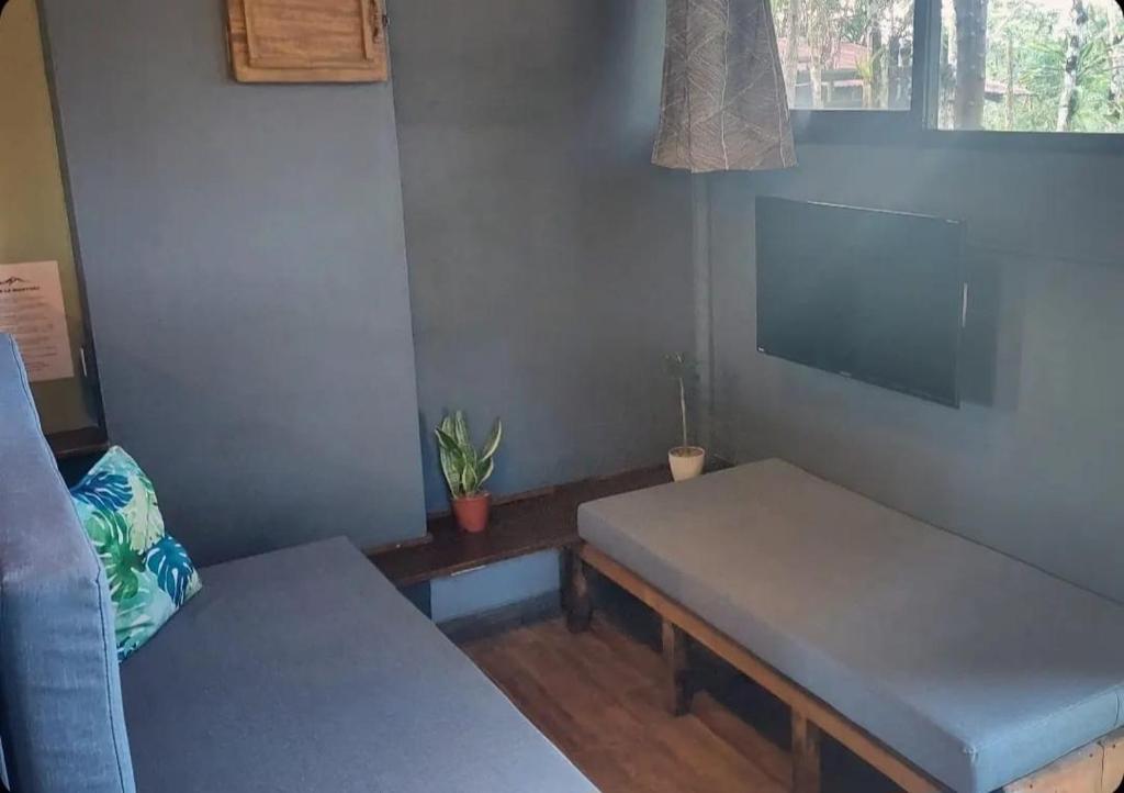 Postel nebo postele na pokoji v ubytování Cabañita La Montaña de Las Brisas