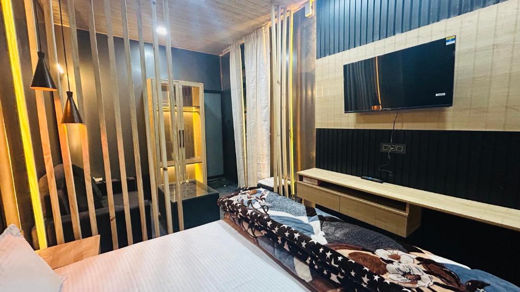 Postel nebo postele na pokoji v ubytování WorthMiles Resort