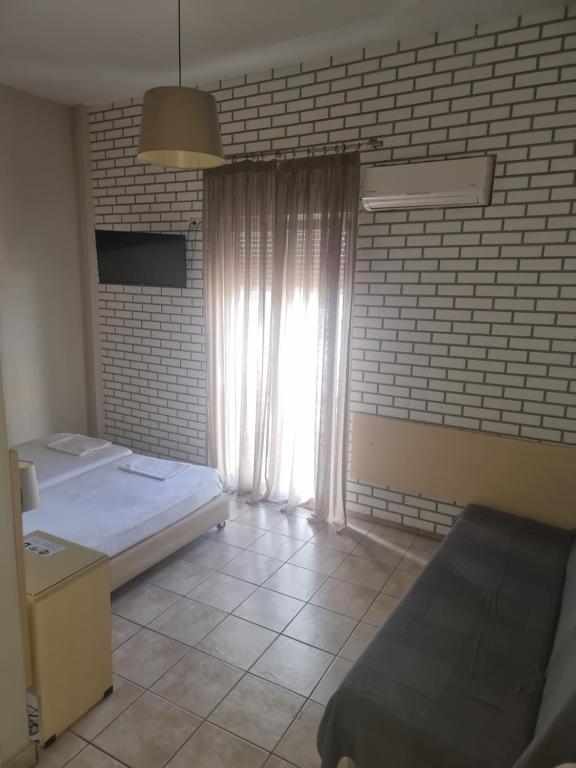 Postel nebo postele na pokoji v ubytování Kentrikon