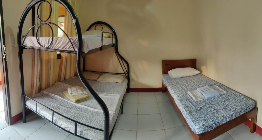 Postel nebo postele na pokoji v ubytování JBR Tourist Inn - Port Barton