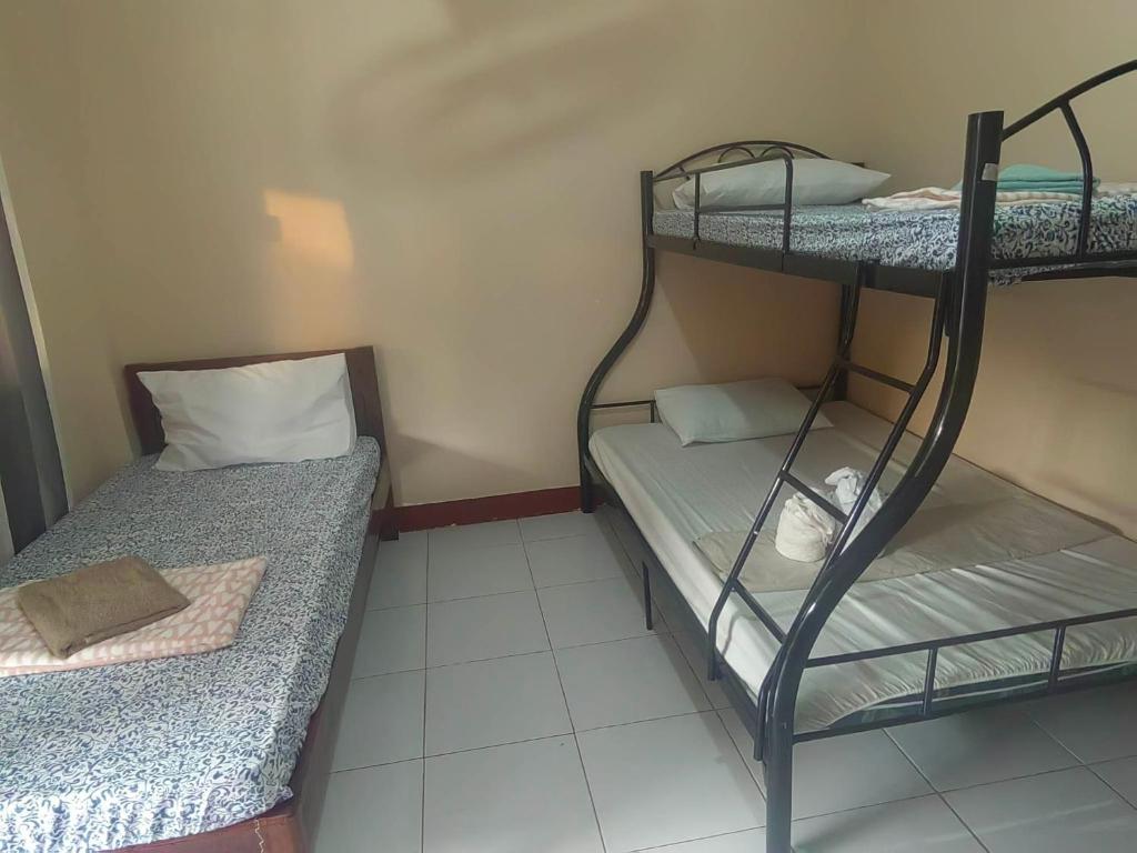 Postel nebo postele na pokoji v ubytování JBR Tourist Inn - Port Barton