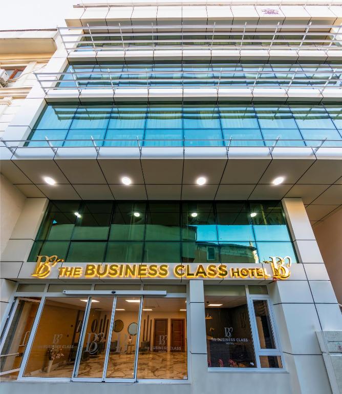 a building with a sign that reads the business glass house at The Business Class Hotel in Istanbul