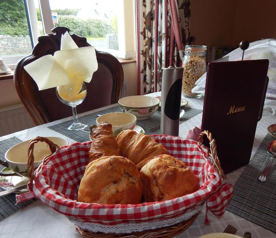 a basket of pastries sitting on a table at Glencove in Ennis