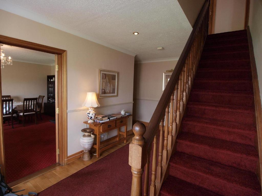 a staircase in a home with a stair case at Glencove in Ennis