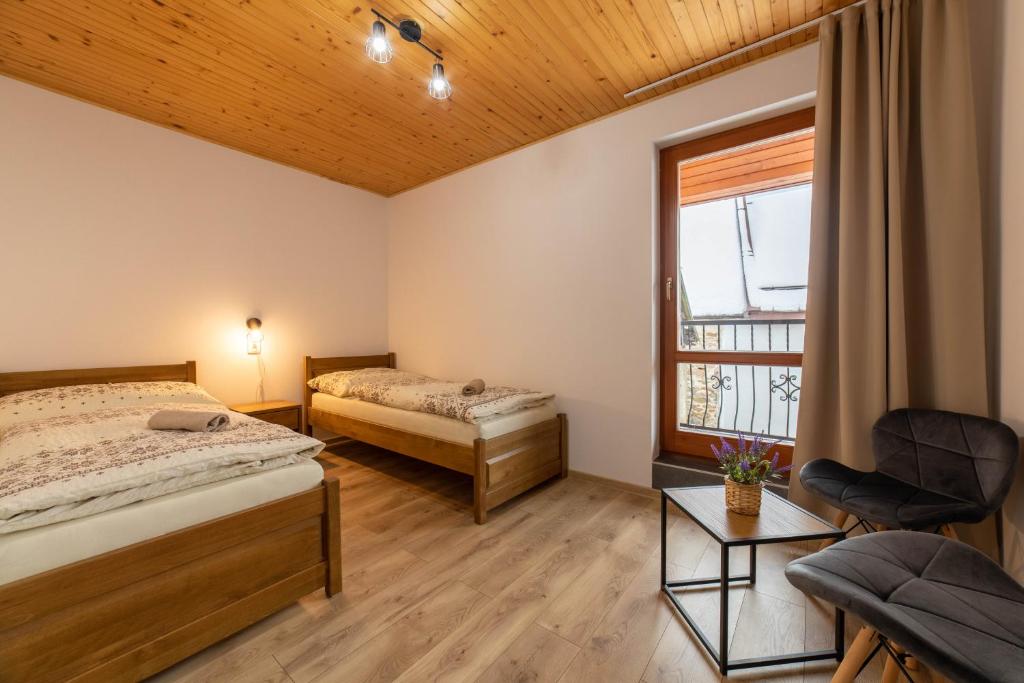 Postel nebo postele na pokoji v ubytování Penzión pod Kýčerou