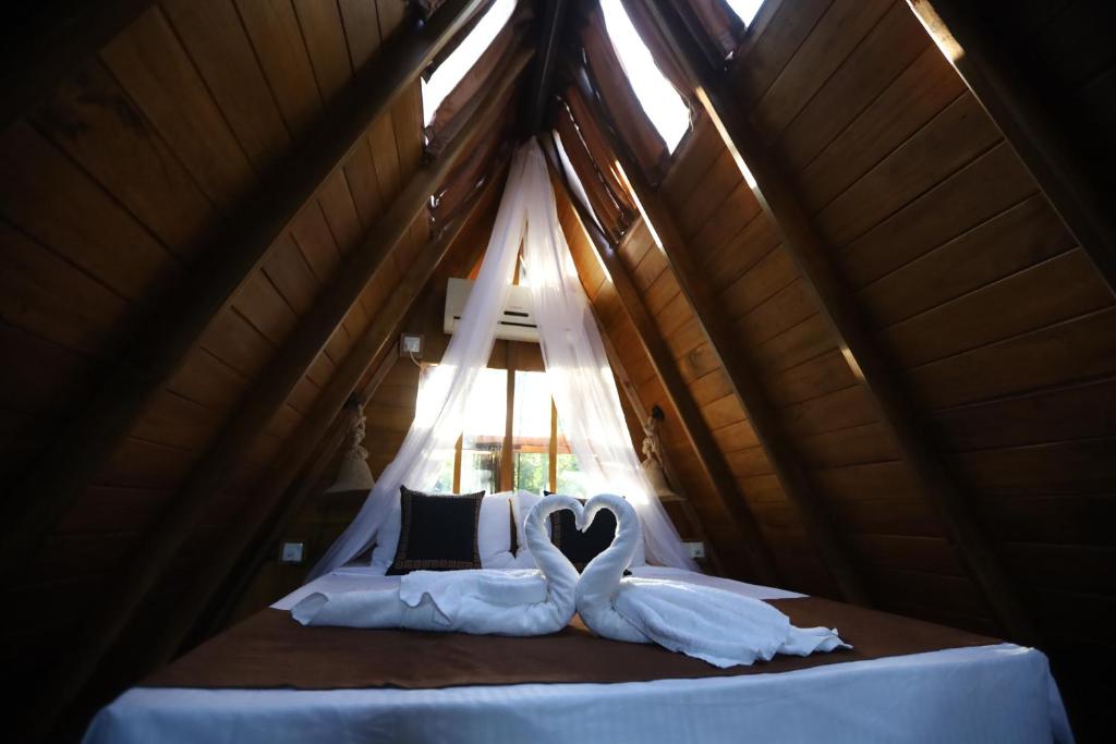 Postel nebo postele na pokoji v ubytování Cinnamon Paradise Cinnamon Room