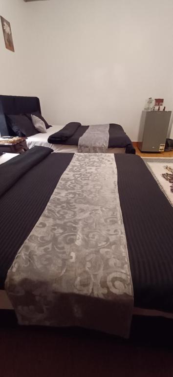 Postel nebo postele na pokoji v ubytování Yoya Hur Pyramids inn