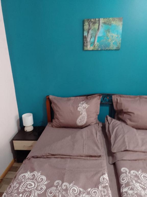 A bed or beds in a room at Top Center Apartment and Rooms Varna
