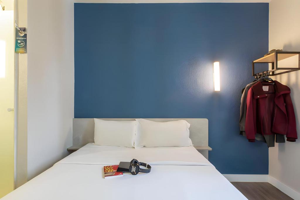 Cama ou camas em um quarto em ibis budget Sao Paulo Morumbi