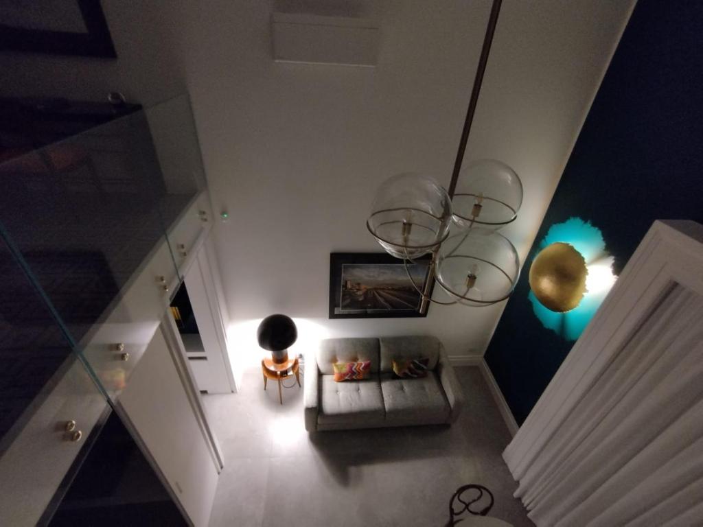 an overhead view of a living room with a couch at Salottino Carafa by Salotto Borbonico in Naples