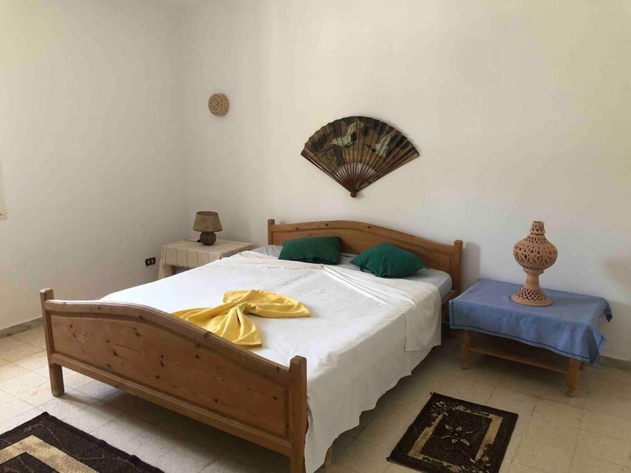 Postel nebo postele na pokoji v ubytování Dar Bolte Djerba
