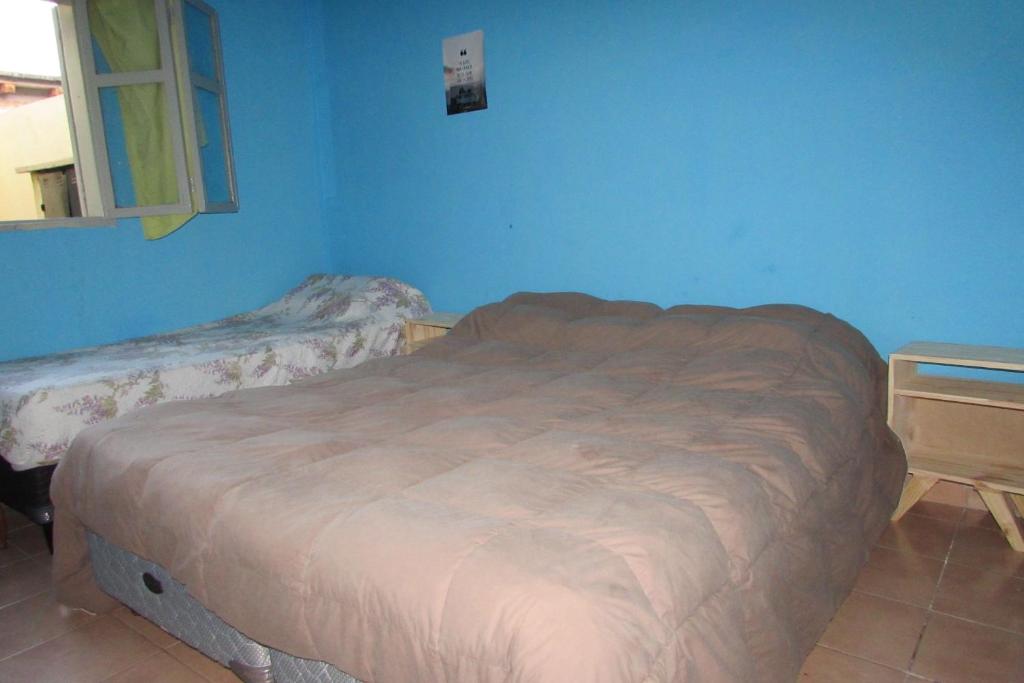 Postel nebo postele na pokoji v ubytování Hostel Céntro Belén
