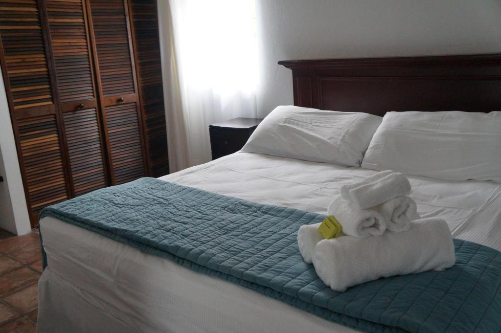 Postel nebo postele na pokoji v ubytování Bravo Beach Hotel