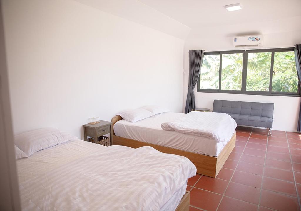 Postel nebo postele na pokoji v ubytování LUA Farmstay