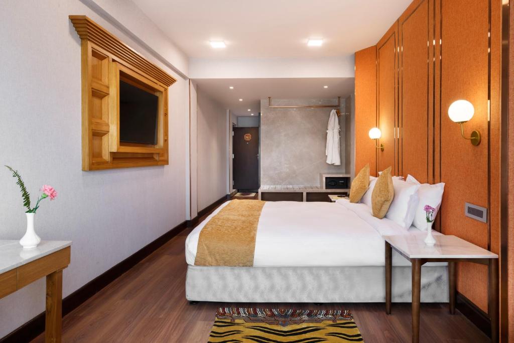 Postel nebo postele na pokoji v ubytování Hotel Tibet