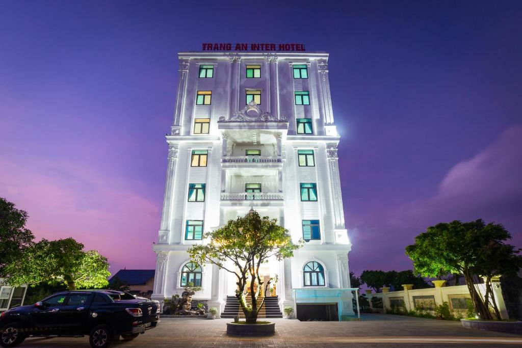 a white building with a sign on top of it at Trang An International Hotel in Ninh Binh