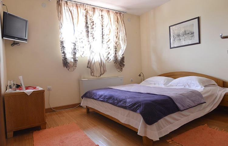 Postel nebo postele na pokoji v ubytování Motel Kneginja