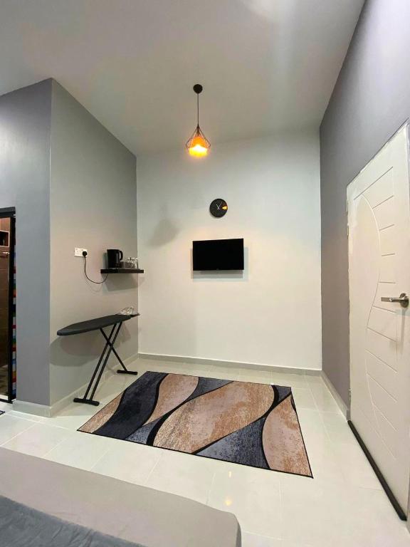 TV a/nebo společenská místnost v ubytování Roomstay Kak Ton