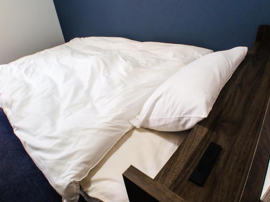Postel nebo postele na pokoji v ubytování Shima no Hotel
