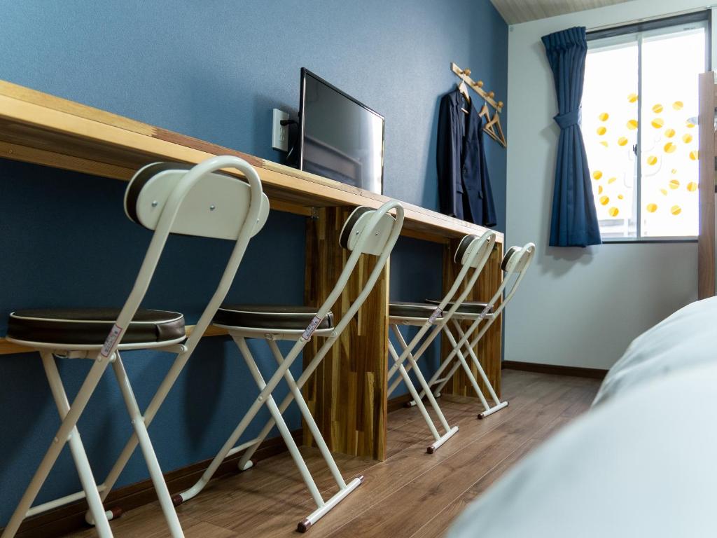 Postel nebo postele na pokoji v ubytování Shima no Hotel