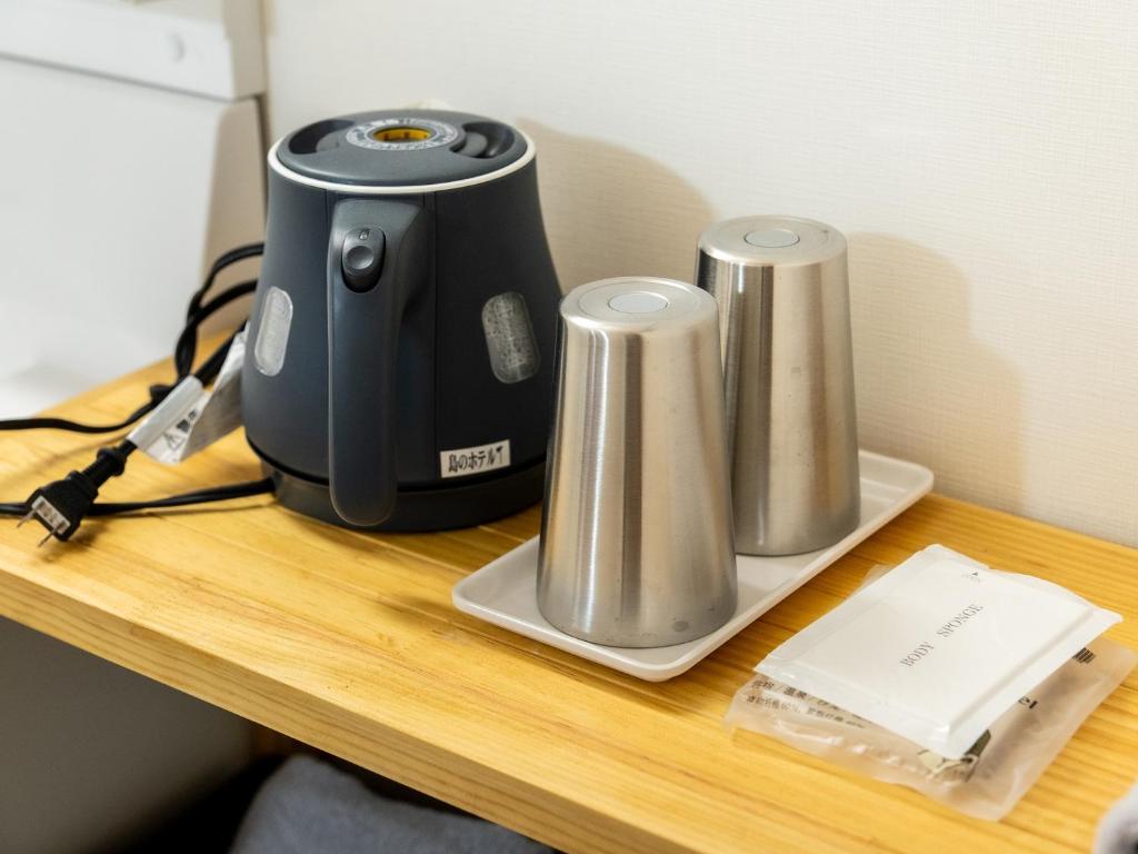 Příslušenství pro přípravu čaje a kávy v ubytování Shima no Hotel