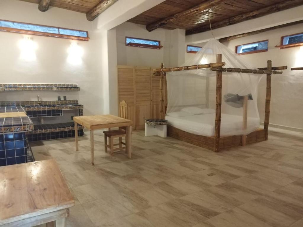 Postel nebo postele na pokoji v ubytování Bambú Ecocabañas