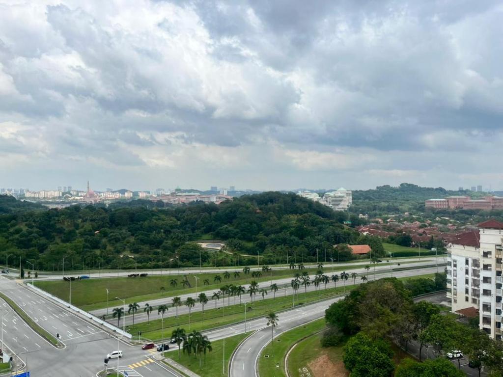 a highway with a city in the distance at Putrajaya Homestay (Zurinn 2) in Putrajaya