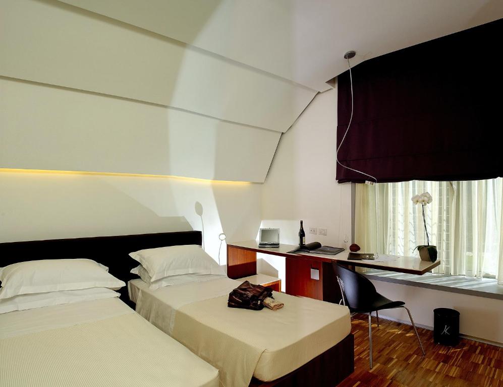 Postel nebo postele na pokoji v ubytování Black Hotel