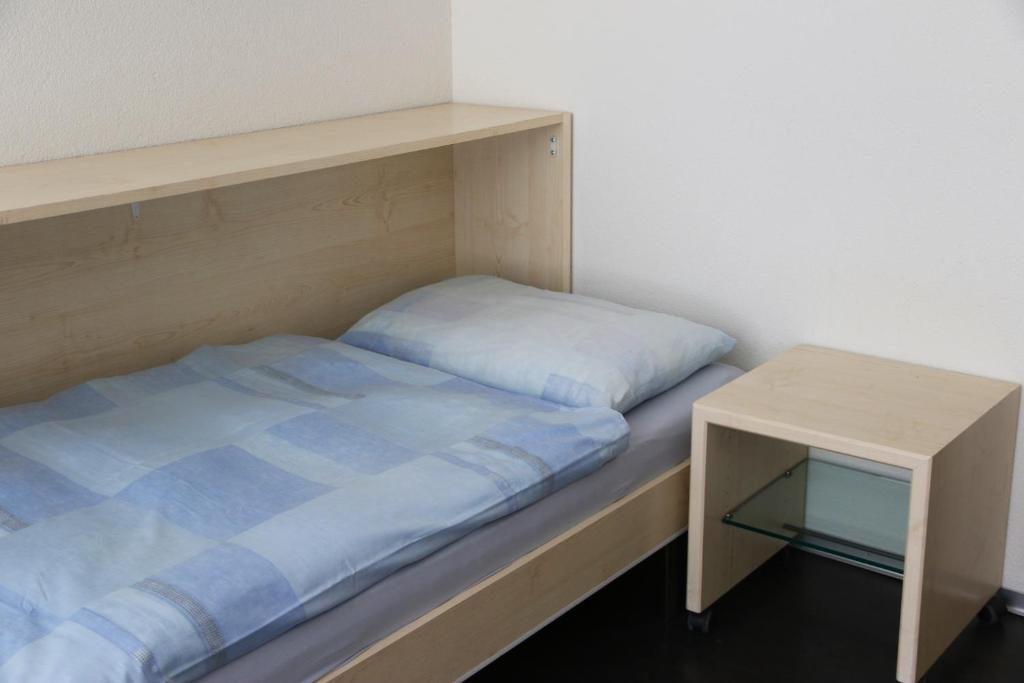 Postel nebo postele na pokoji v ubytování Richemont Hotel