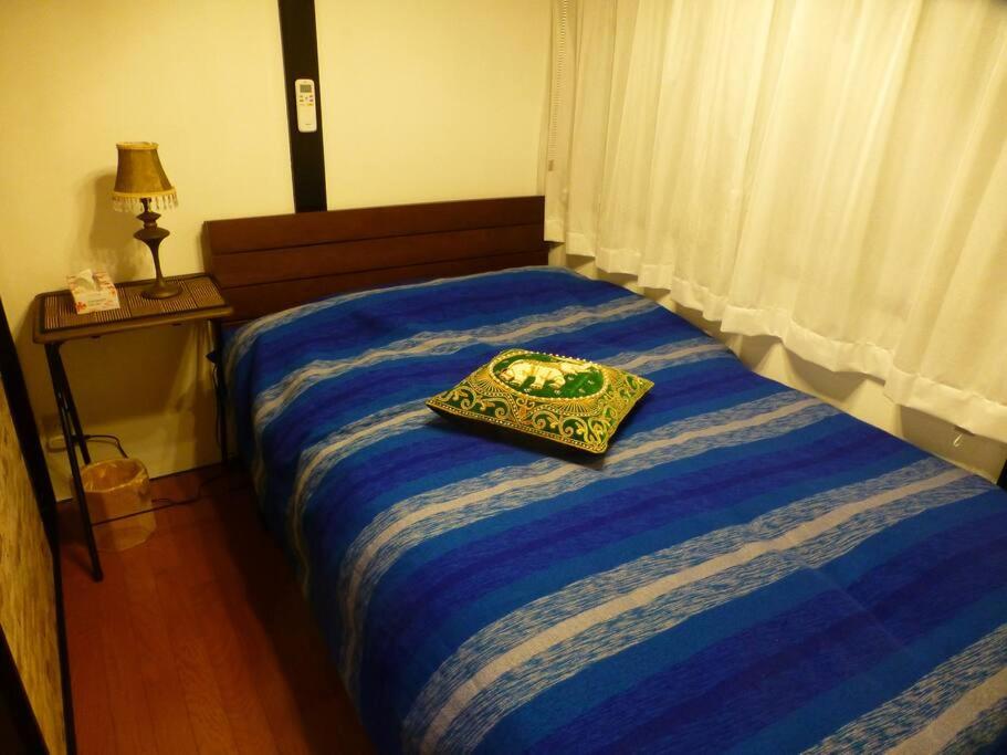 Postel nebo postele na pokoji v ubytování こや・かやき