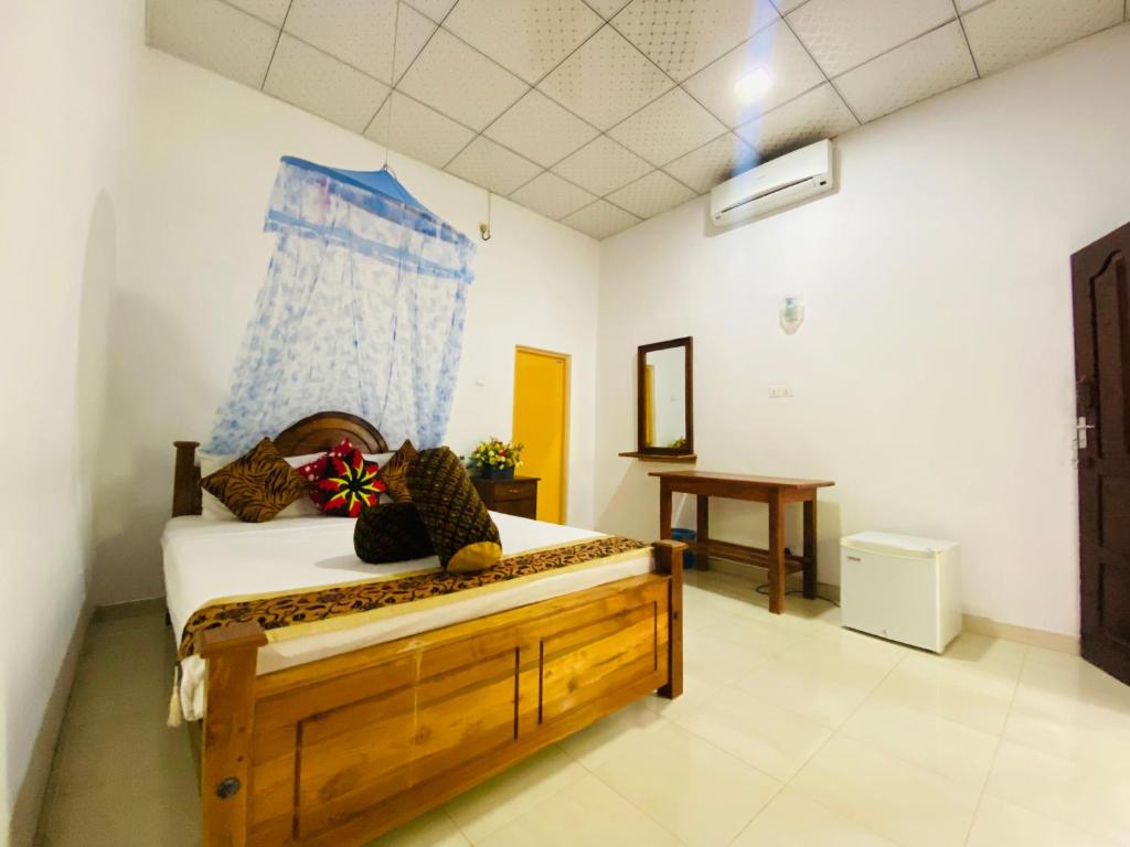 Postel nebo postele na pokoji v ubytování Priyavimana resort