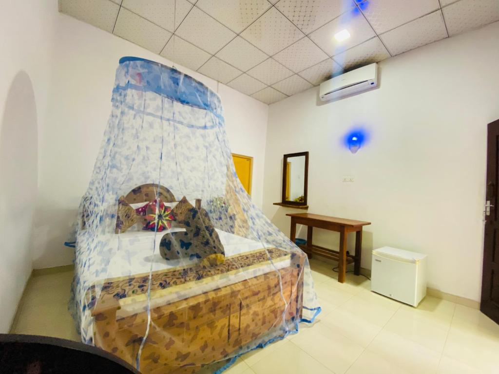 Postel nebo postele na pokoji v ubytování Priyavimana resort