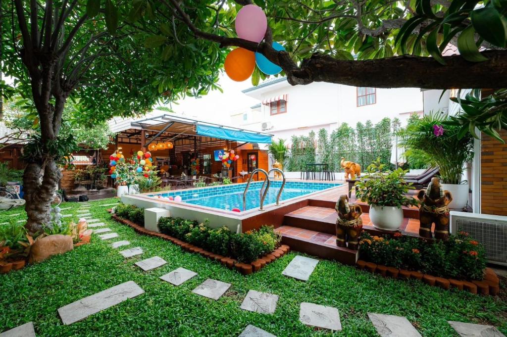 a pool in the yard of a building at Amit Resort 51 Hua Hin in Hua Hin