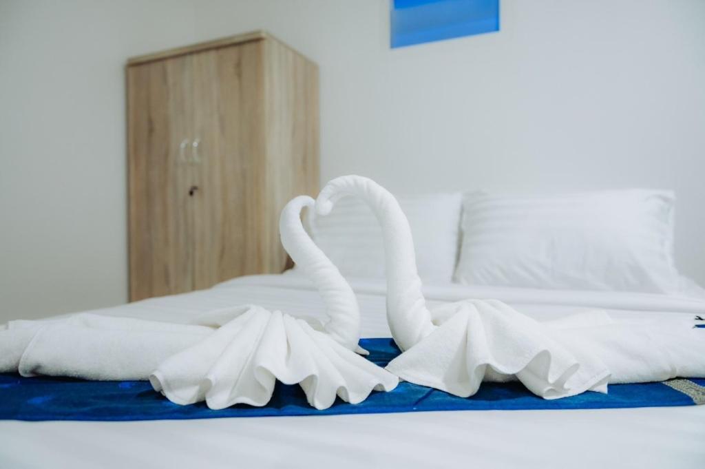 Postel nebo postele na pokoji v ubytování Amit Resort 51 Hua Hin