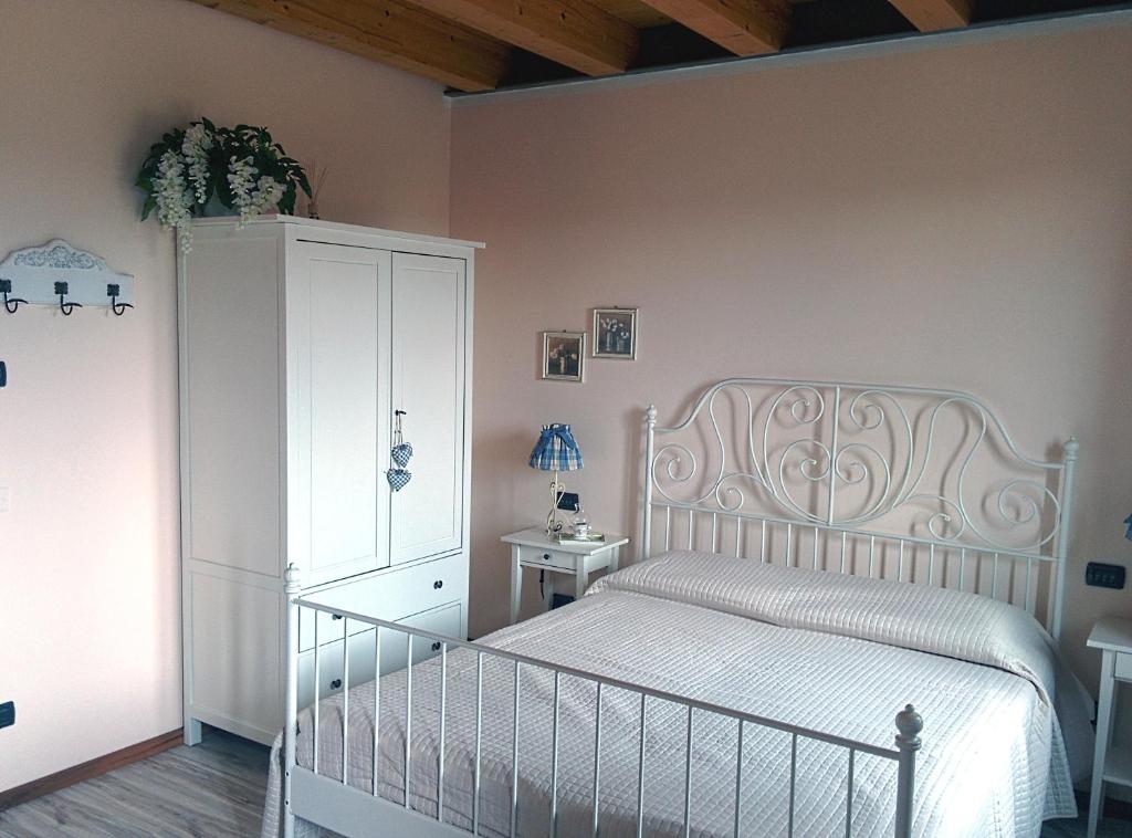 Postel nebo postele na pokoji v ubytování Ca' Dei Coci B&B