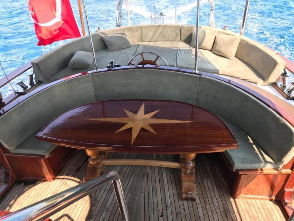 a wooden table on a boat with a star on it at cemal efe in Fethiye