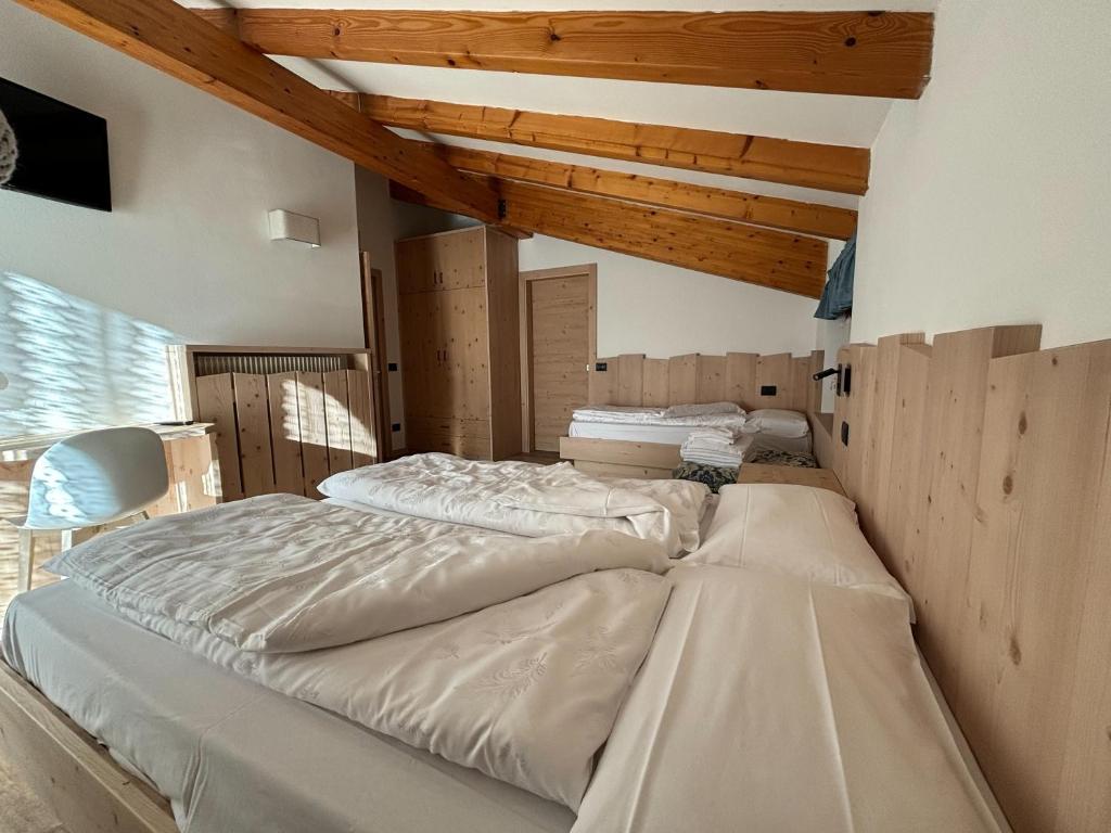 Postel nebo postele na pokoji v ubytování Residence Cima Tosa