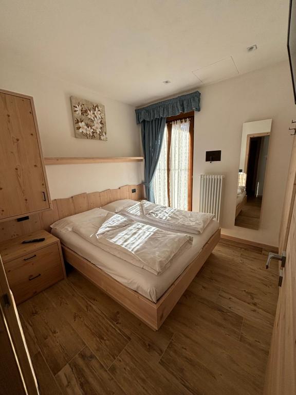 Postel nebo postele na pokoji v ubytování Residence Cima Tosa