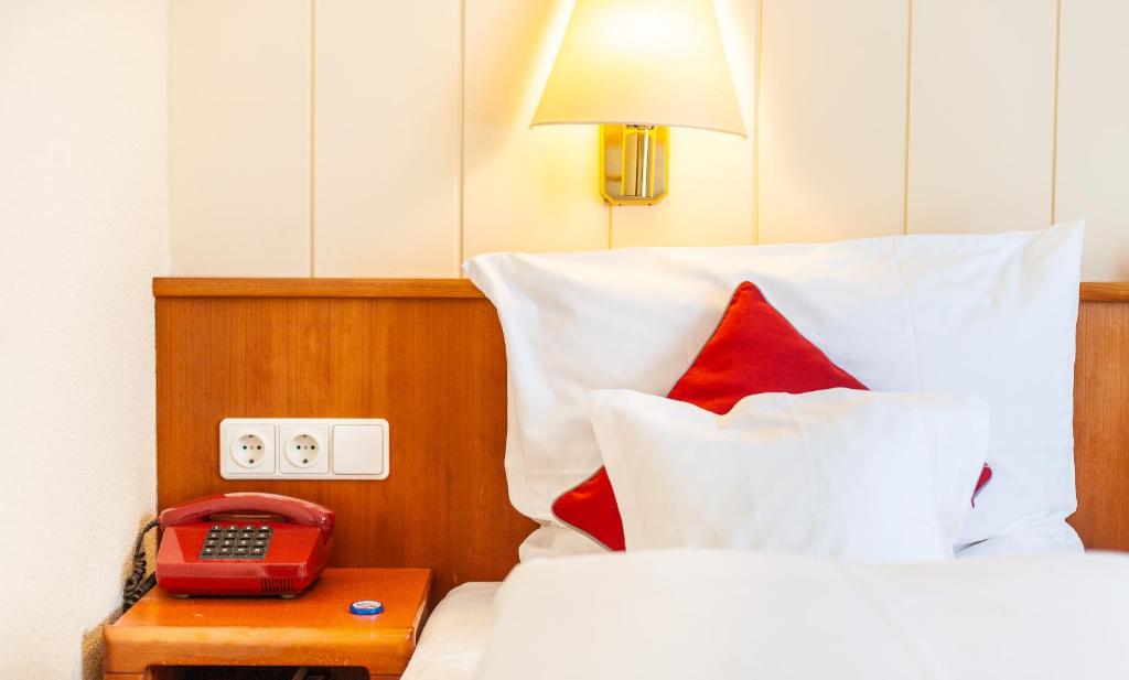 Postel nebo postele na pokoji v ubytování Hotel Friese