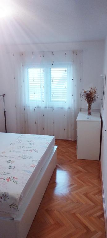 Postel nebo postele na pokoji v ubytování Apartman Makarska
