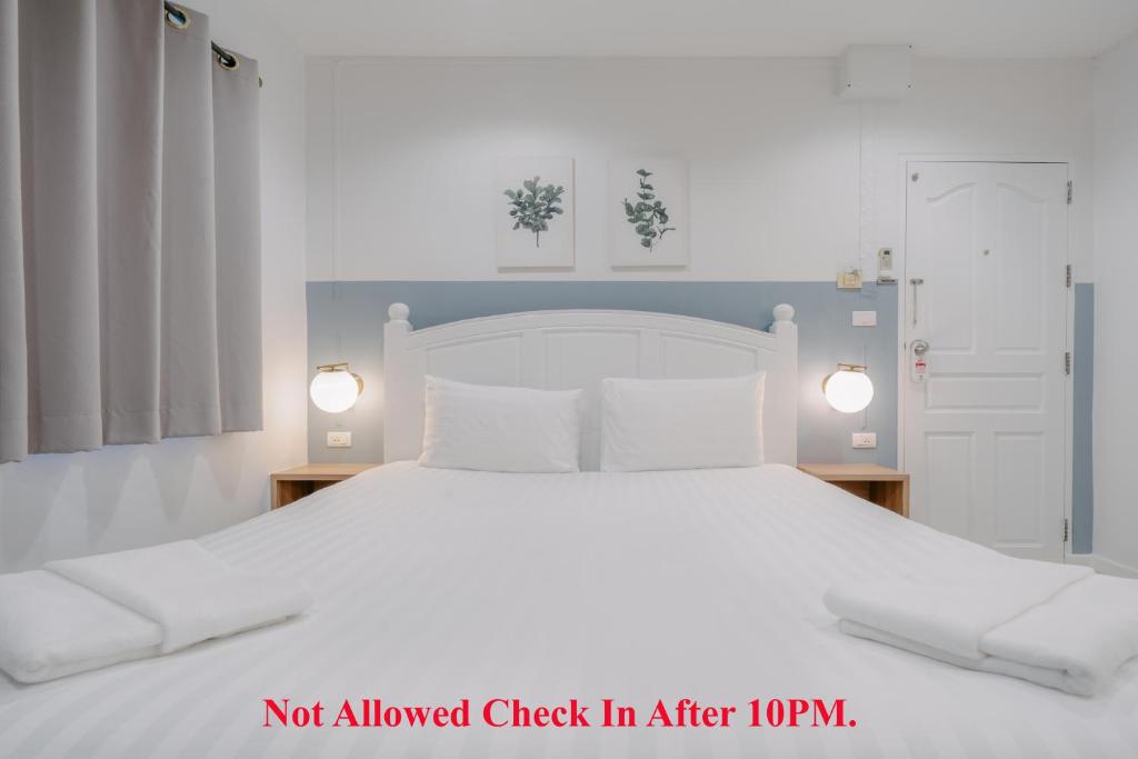 Postel nebo postele na pokoji v ubytování Baan Sutra Guesthouse