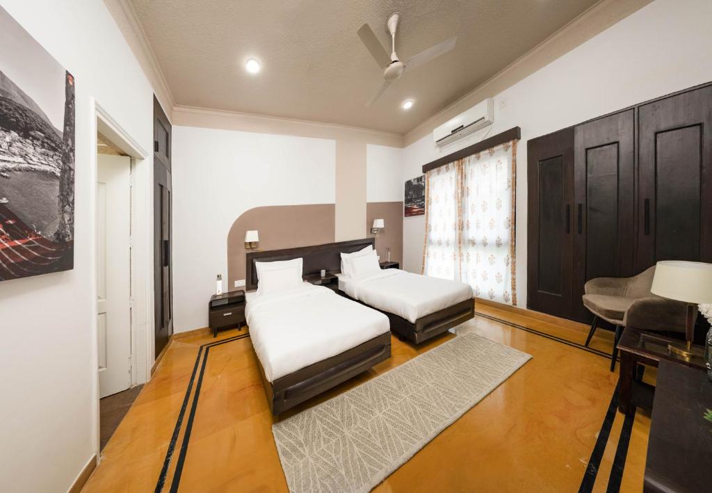 Postel nebo postele na pokoji v ubytování Firebrick Boutique Residences - GARNET HOUSE