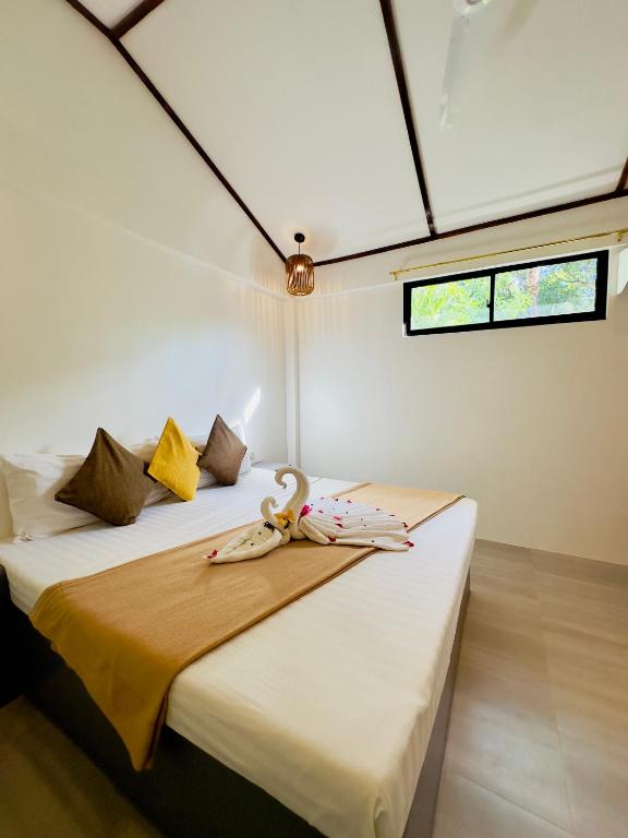 Postel nebo postele na pokoji v ubytování El Nido Coco Resort