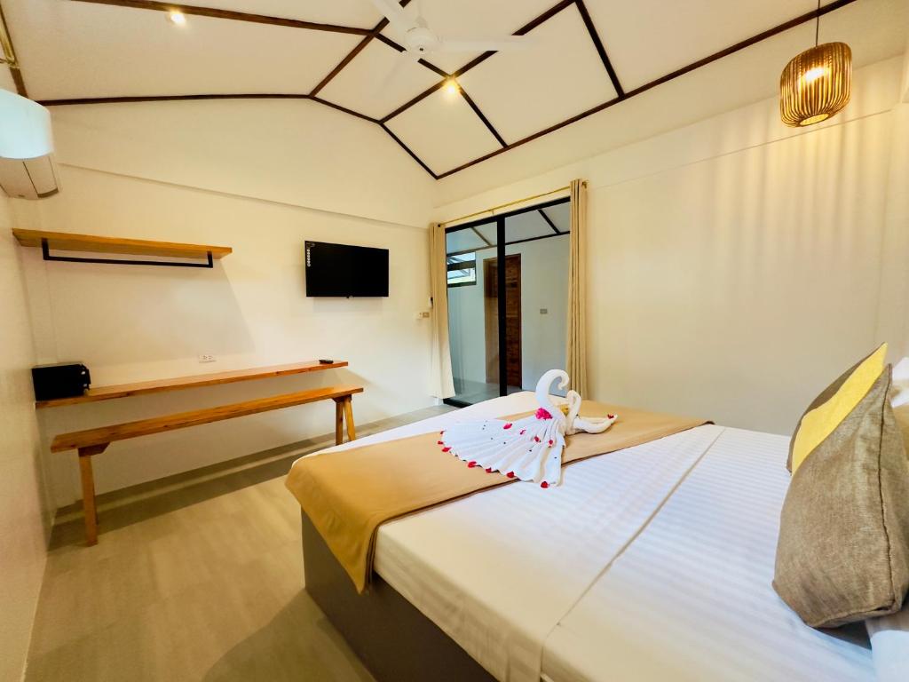 Postel nebo postele na pokoji v ubytování El Nido Coco Resort