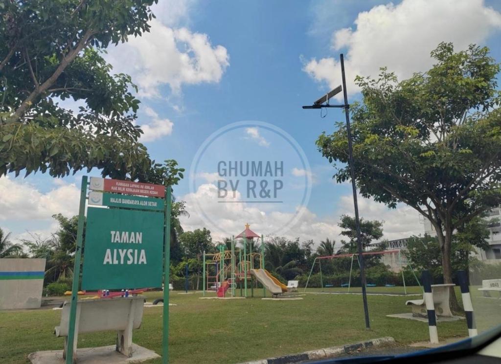 a sign in a park with a playground at Ghumah by R&P (near Hospital Sultanah Bahiyah) in Alor Setar