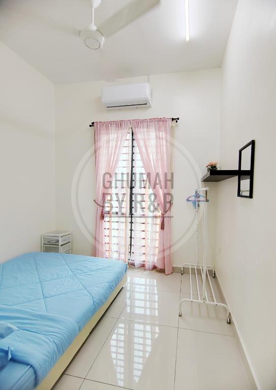 a hospital room with a bed and a window at Ghumah by R&P (near Hospital Sultanah Bahiyah) in Alor Setar
