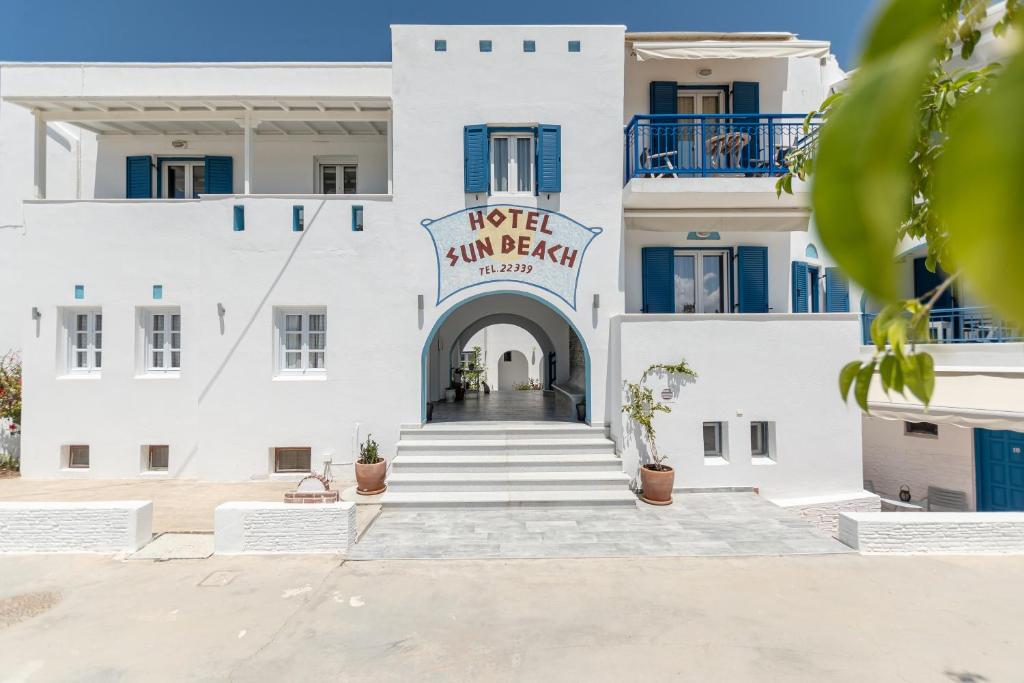 a building with a sign that reads hotel sun beach at Sun Beach Hotel in Naxos Chora