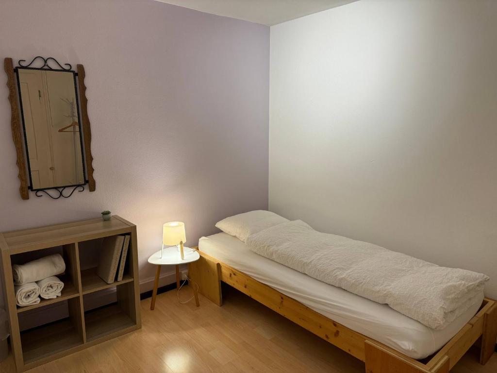 Postel nebo postele na pokoji v ubytování Downtown Apartments