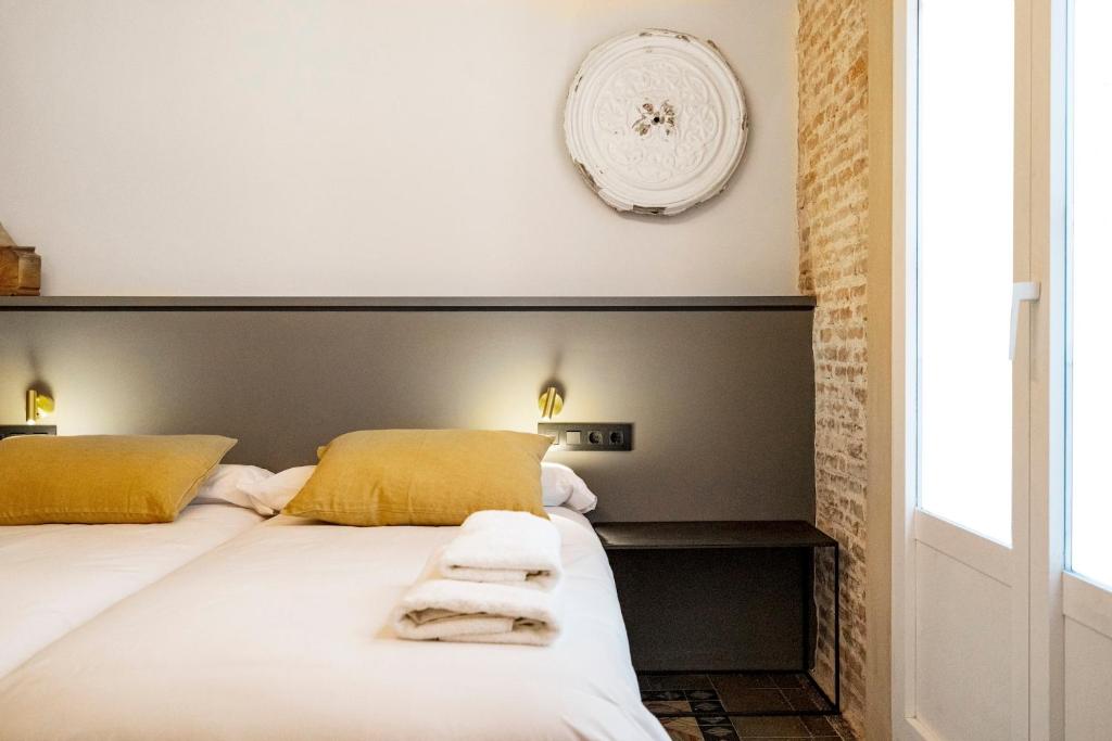 Postel nebo postele na pokoji v ubytování Hostal Porxos Garden