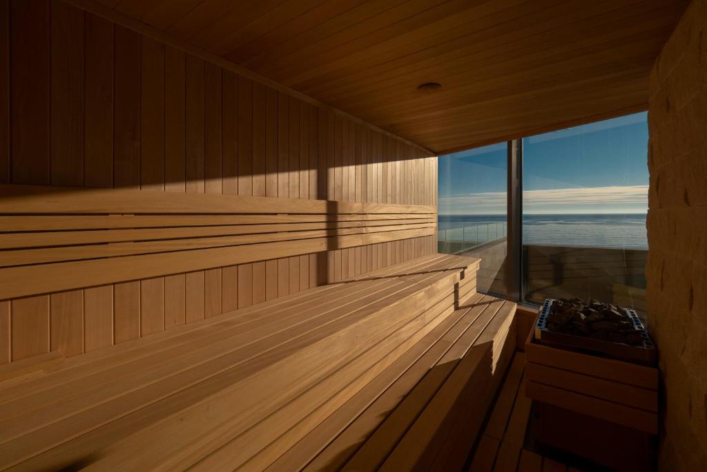 an empty sauna with a view of the ocean at Sea Star Budva in Budva